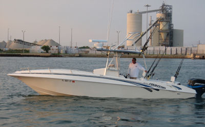 Captain Dusty McGee has 30 years of experience in charter and tournament fishing as a licensed captain.  Here he is pictured with his tournament rigged, 60 mph, 31 foot Fountain offshore power boat.